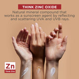 Three hands with different skin tones holding a beige color swatch, with text about zinc oxide and Think Zinc branding.