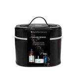 The Skinceuticals Holiday The Age Rewind Set displayed with its retail black bag packaging