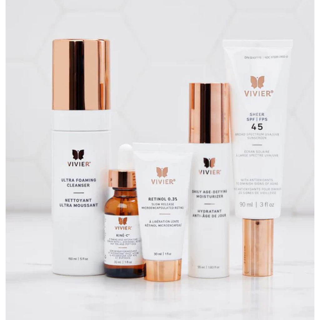 Close-up view of Vivier Youth Preserve Program anti-aging skincare set, showcasing full-size products like Ultra Foaming Cleanser, Kine-C®, Retinol 0.3%, Daily Age-Defying Moisturizer, and SHEER SPF 45, in a chic vegan leather bag for a complete skincare routine