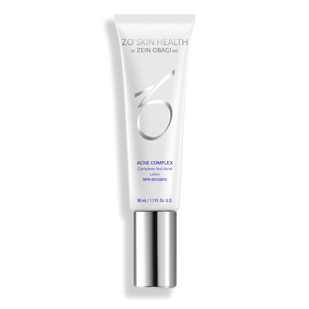 Product image of ZO® Acne Complex in sleek silver and white packaging, formulated to target all stages of acne formation, reduce active breakouts, prevent future blemishes, and improve the appearance of post-acne marks and texture