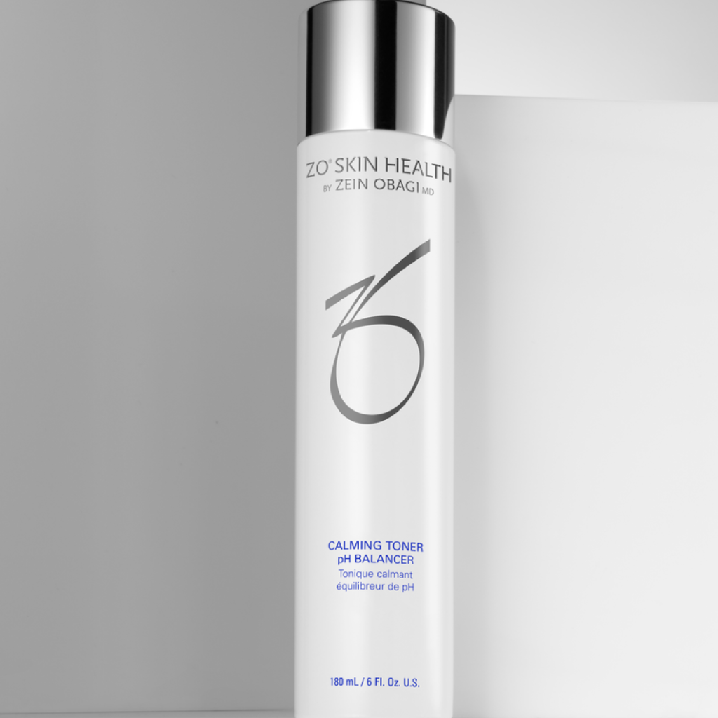 ZO Skin Health Calming Toner pH Balancer 180ml bottle displayed against a grey background wall, highlighting its alcohol-free formula with witch hazel and hydrators for soothing sensitive skin