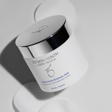 ZO Skin Health Complexion Renewal Pads jar with three textured exfoliating pads displayed in the background, showcasing pre-soaked salicylic acid formula for refining pores and controlling oil