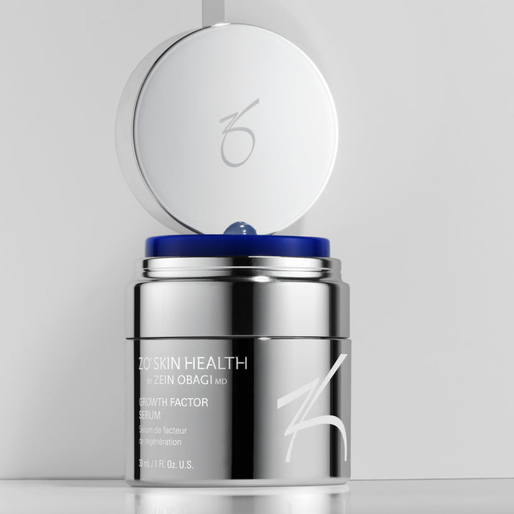 Close-up product image of ZO Growth Factor Serum (30ml) with the jar open, showcasing the lightweight, gel-like texture designed to visibly firm, smooth, and rejuvenate skin