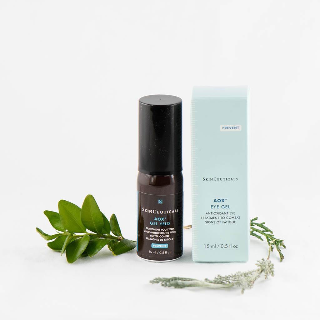 SkinCeuticals AOX+ Eye Gel displayed with flowers, highlighting its soothing antioxidant formula for under-eye puffiness and fatigue
