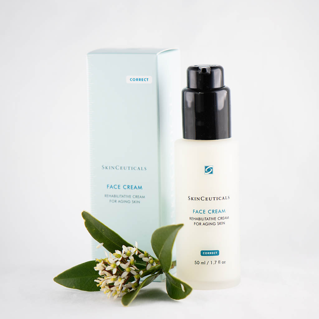 SkinCeuticals Face Cream jar displayed beside a delicate flower, highlighting its elegant, hydrating formula for mature skin and visible signs of aging