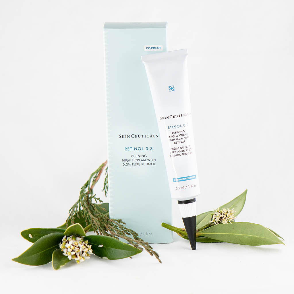 SkinCeuticals Retinol 0.3 tube displayed with delicate flowers – highlighting its gentle yet effective formulation for refining skin texture and minimizing early signs of aging.