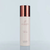 A bottle of the Hydrinity Hyacyn Active Purifying Mist on a soft light blue background