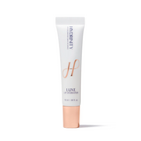 A tube of Hydrinity Lip Luxe Hydrator with a white body and gold detailing, on a light background.