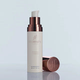 A bottle of Hydrinity Renewing HA Serum with its cap off showcasing its white pump on a light blue background