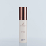 A bottle of Hydrinity Renewing HA Serum with a white label and a copper-colored cap on a light blue background