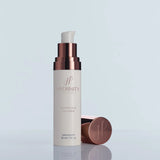 Hydrinity Restorative HA Serum bottle with its cap off on a light blue background