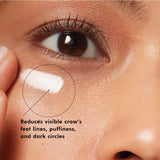 Swatch of SkinCeuticals A.G.E. Advanced Eye cream on medium skin showing texture and finish
