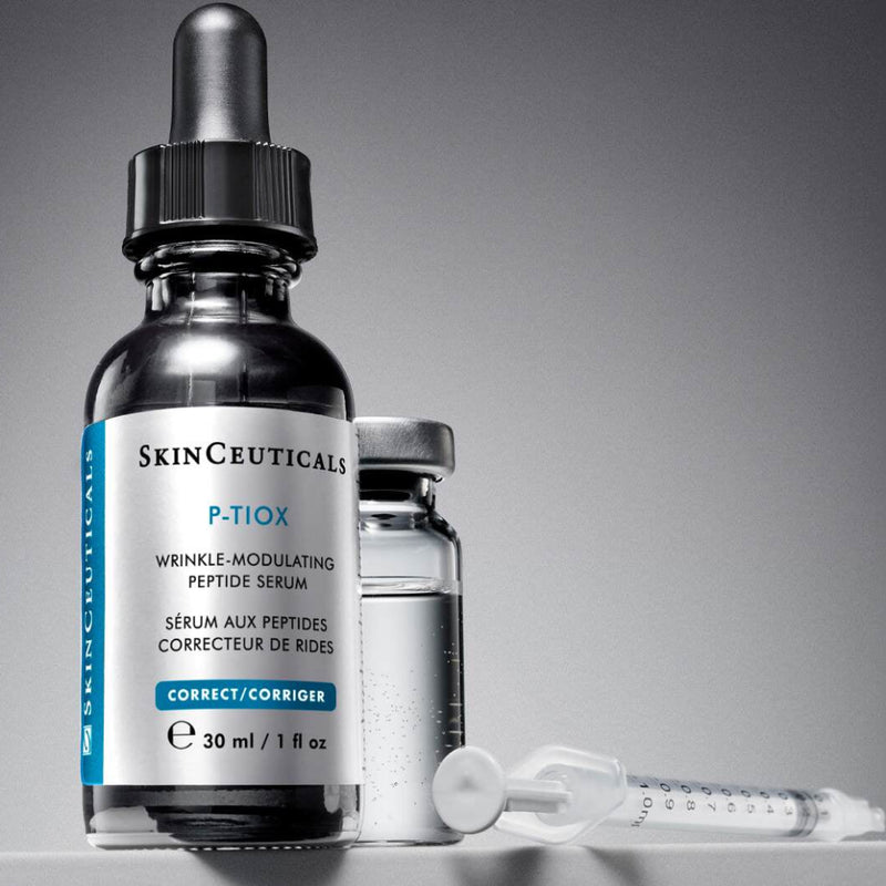 SkinCeuticals P-TIOX serum placed beside a syringe on a sterile surface, visually representing its role as a needle-free alternative or complement to injectable wrinkle treatments