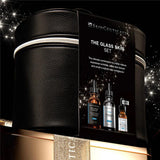 The Skinceuticals Holiday The Glass Skin Set displayed on top of a gold box with gold ribbon against a starry night background