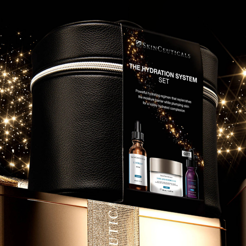 The Skinceuticals Holiday The Hydration System Set displayed on top of a gold box with gold ribbon against a starry night background