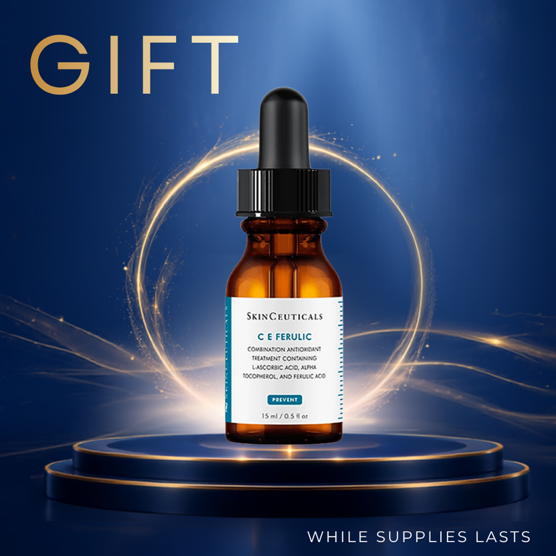 A 15 ml bottle of SkinCeuticals C E Ferulic combination antioxidant treatment, presented on a dark blue pedestal with glowing gold light effects and a 'GIFT' banner.
