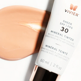 Close-up of Vivier Sheer SPF 30 Mineral Tinted Sunscreen's smooth, creamy texture, ready to be applied for a natural glow and sun protection