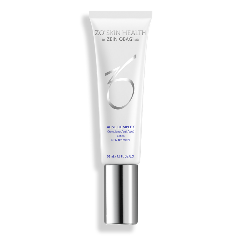 Product image of ZO® Acne Complex in sleek silver and white packaging, formulated to target all stages of acne formation, reduce active breakouts, prevent future blemishes, and improve the appearance of post-acne marks and texture