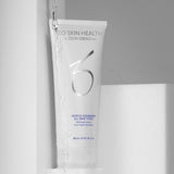 ZO Exfoliating Cleanser – White and blue tube of facial cleanser with flowing water in the background, symbolizing freshness and hydration