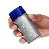 Product image of ZO® Sheer Fluid Broad-Spectrum Sunscreen SPF 50 bottle held in hand, showcasing its portable size and sleek packaging—ideal for daily use with lightweight, sheer protection against UVA/UVB, infrared, and blue light