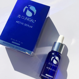 IS Clinical Active Serum bottle and packaging on a white background