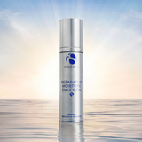 Skincare bottle labeled 'Reparative Moisture Emulsion' floating on water during sunrise