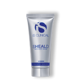 A gray and blue tube of the iS Clinical SHEALD Recovery Balm.