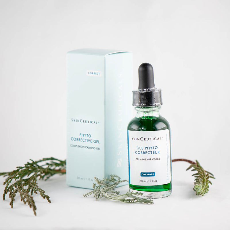 SkinCeuticals Phyto Corrective Gel bottle styled with botanical flowers – highlighting its plant-based formula that calms, hydrates, and reduces redness in sensitive or irritated skin
