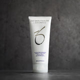 ZO Exfoliating Cleanser – White and blue tube of exfoliating facial cleanser standing upright against a gray background