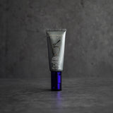 A tube of ZO Smart Tone Broad-Spectrum Sunscreen SPF 50 displayed against a dark background, emphasizing its sleek, modern packaging. The contrast highlights the premium design and advanced sun protection formula.